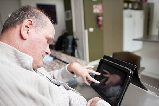 A man using an iPad